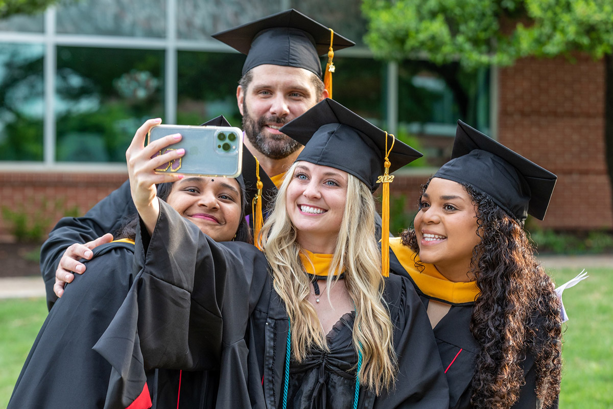 graduates taking a selfie