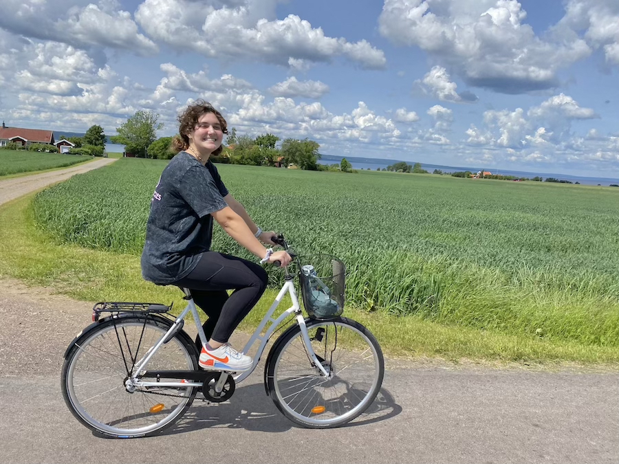 Student Shealynn Lander bicycles on Sweden's Visingso Island during a June 2022 Study Abroad trip.
